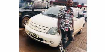 Douglas Lwanga gifts Purple Party Manager with Car