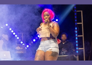 A fan attempts to bonk Winnie Nwagi live on stage 