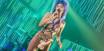 Shocking: Miley Cyrus Wears A Penis and Bares Breasts (Photos)