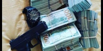 SK Mbuga Brags On Social Media, Shows Off Gun & Money