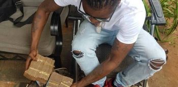 Weasel Gets A Promotion...From Carrying Bags Of Posho To Guarding Bryan White's Money