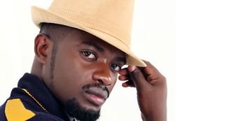 David Lutalo vends concert tickets in Owino Market