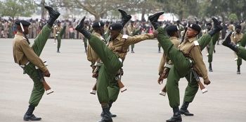 Hilarious! Kenyan Officer Slips and Falls During A Parade In Front Of President Uhuru (Video)