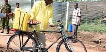 President Museveni Pulls Magufuli’s Stunt, Fetches Water On A Bicycle