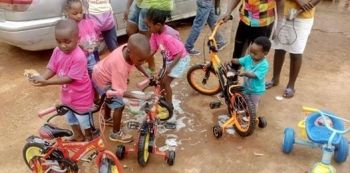 Adorable Kids Gun For The Save Carol Car Wash In Mbarara — Photos
