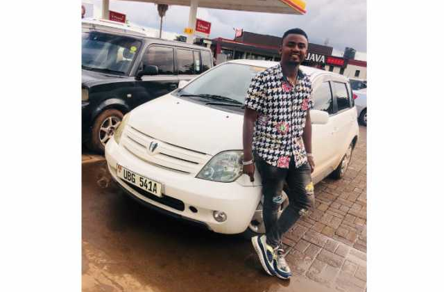 Douglas Lwanga gifts Purple Party Manager with Car