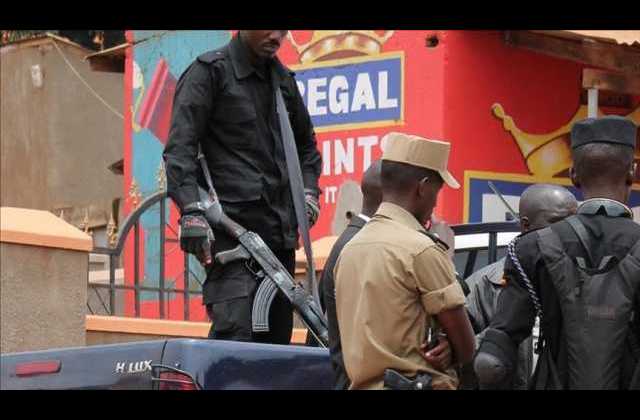 Police officers arrest two men in connection with murder and robbery at Muzuri Hotel Tororo