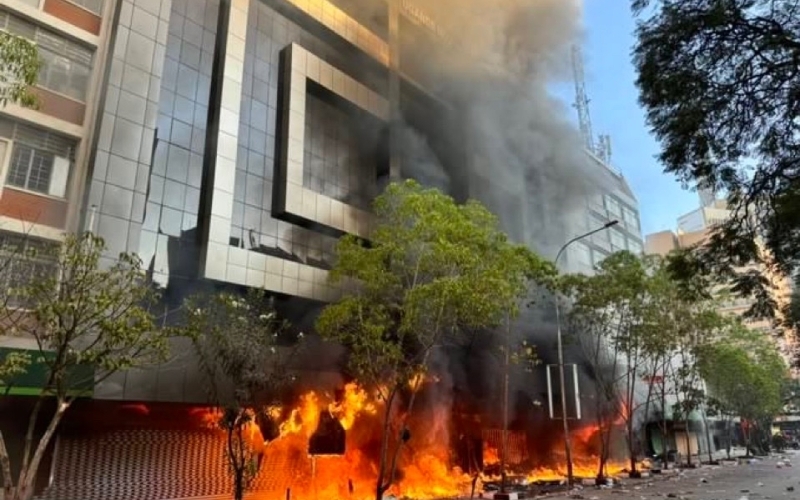 Investigate burning of Uganda House in Kenya