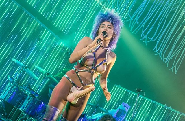 Shocking: Miley Cyrus Wears A Penis and Bares Breasts (Photos)