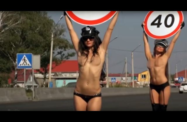 The Breast Way To Stop Speeding: Russian Road Safety Experts Employ Topless Women To Hold Speed Limit Signs To Slow Down Drivers