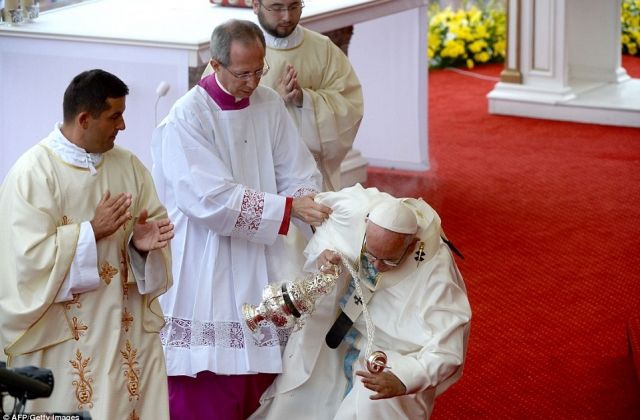 Pope Francis FALLS OVER during Mass—Photos
