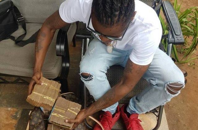 Weasel Gets A Promotion...From Carrying Bags Of Posho To Guarding Bryan White's Money