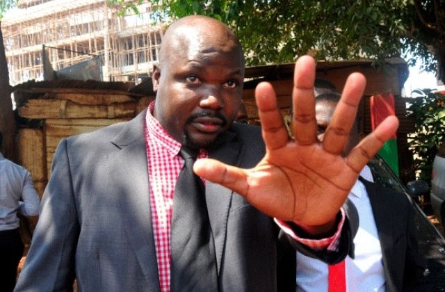 Munyagwa Carries Comedy to Parliament, wants Besigye freed Immediately
