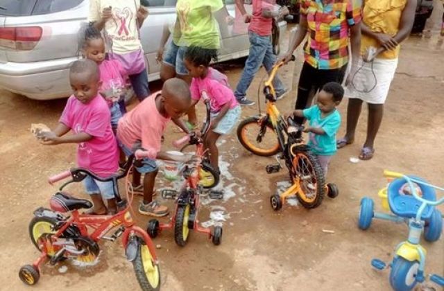 Adorable Kids Gun For The Save Carol Car Wash In Mbarara — Photos