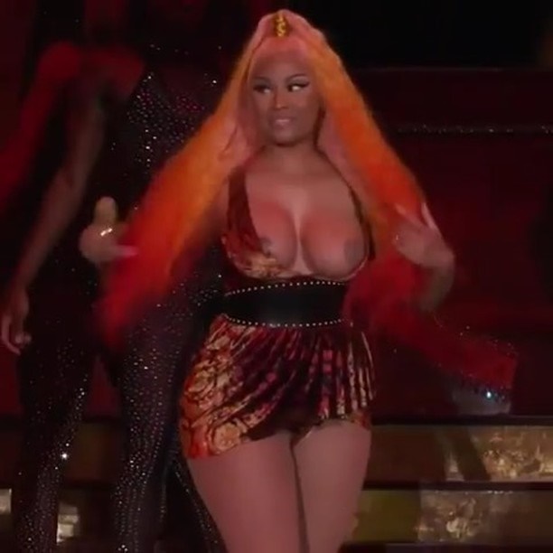 Nicki Minaj's boobs slipped out of dress while performing 